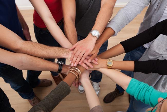 volunteers hands together